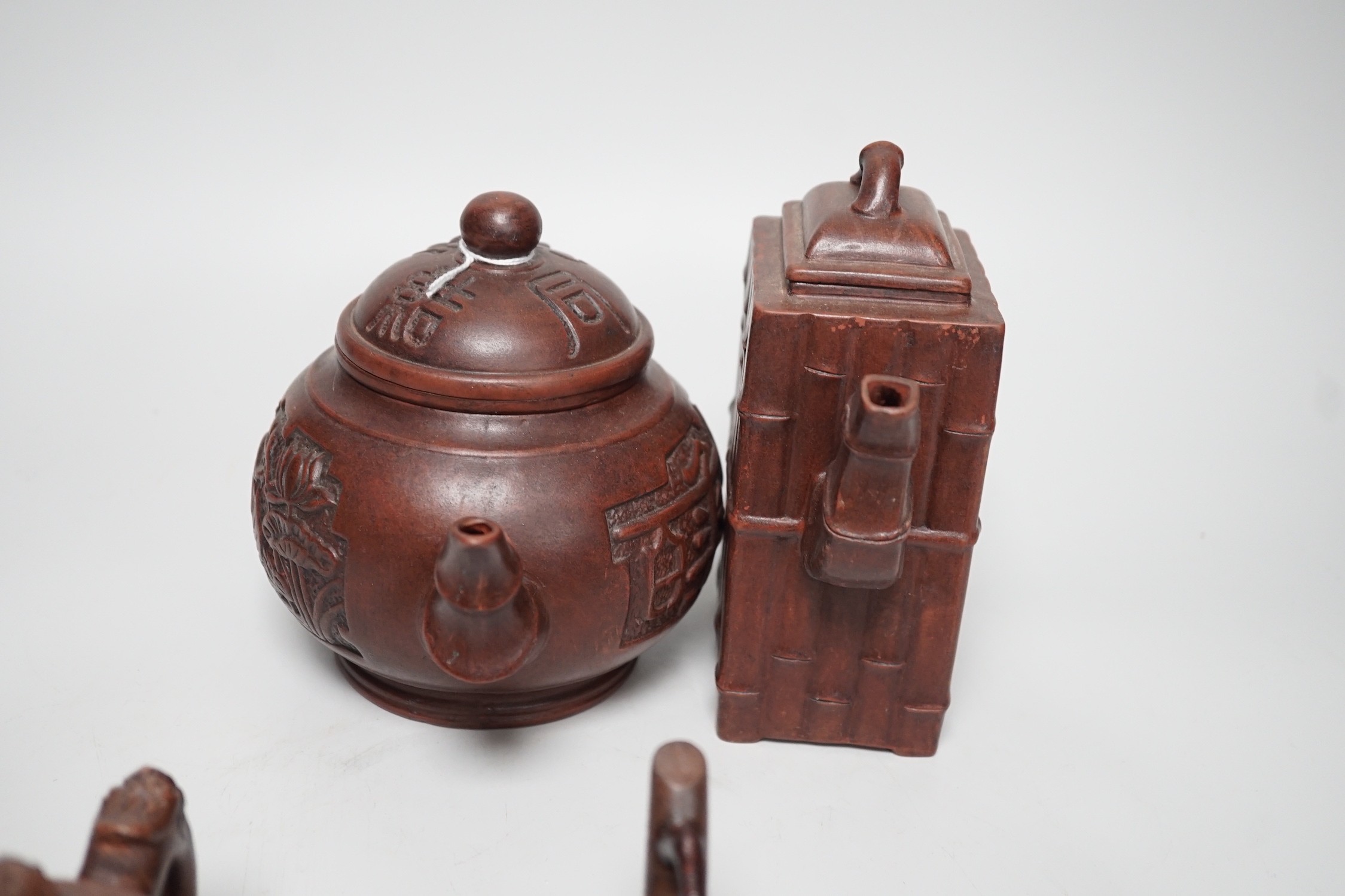 A collection of five Chinese Yixing teapots, tallest 6.5cms high